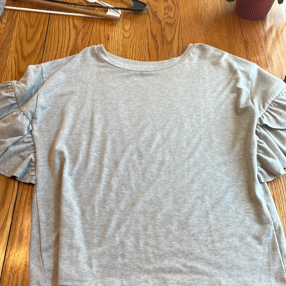 Grey top.